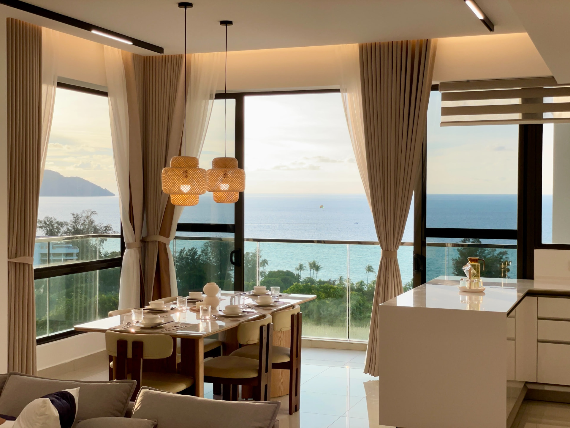 The Marin showroom dining area with sea view at sunset